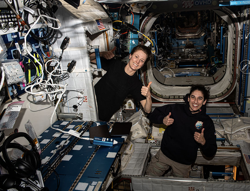 Astronauts Loral O'Hara and Jasmin Moghbeli give a thumbs up